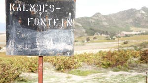 a sign on the side of a mountain