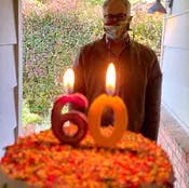 a birthday cake with lit candles