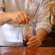 a man sitting at a table with a knife