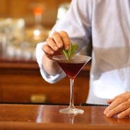 a person sitting at a table in a restaurant